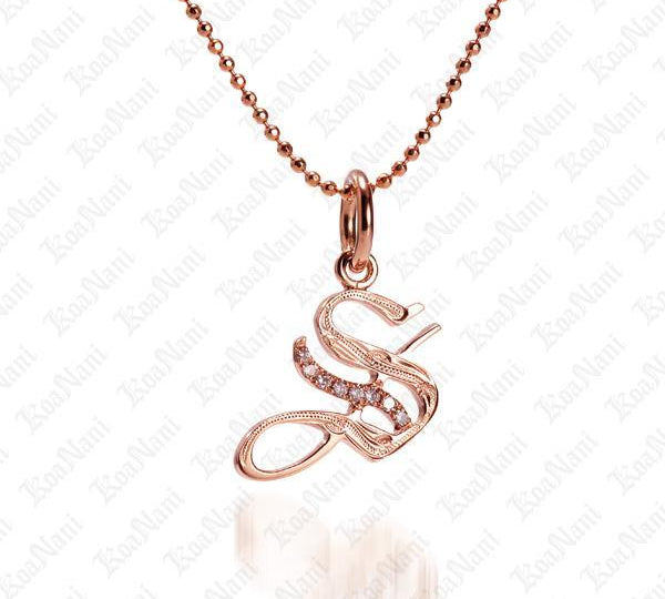 The picture shows a 14K rose gold Koa Nani S initial pendant.