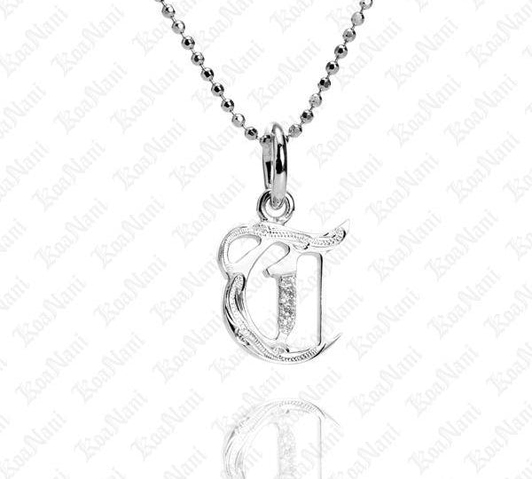 The picture shows a 14K white gold Koa Nani T initial pendant.