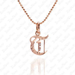 The picture shows a 14K rose gold Koa Nani T initial pendant.