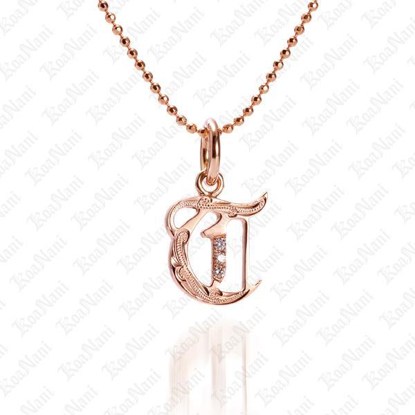 The picture shows a 14K rose gold Koa Nani T initial pendant.