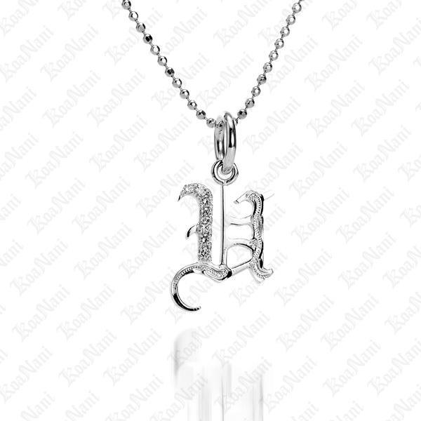 The picture shows a 14K white gold Koa Nani U initial pendant.