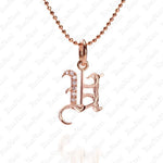 The picture shows a 14K rose gold Koa Nani U initial pendant.