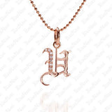 The picture shows a 14K rose gold Koa Nani U initial pendant.