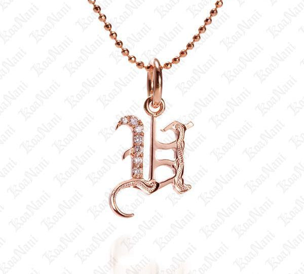 The picture shows a 14K rose gold Koa Nani U initial pendant.