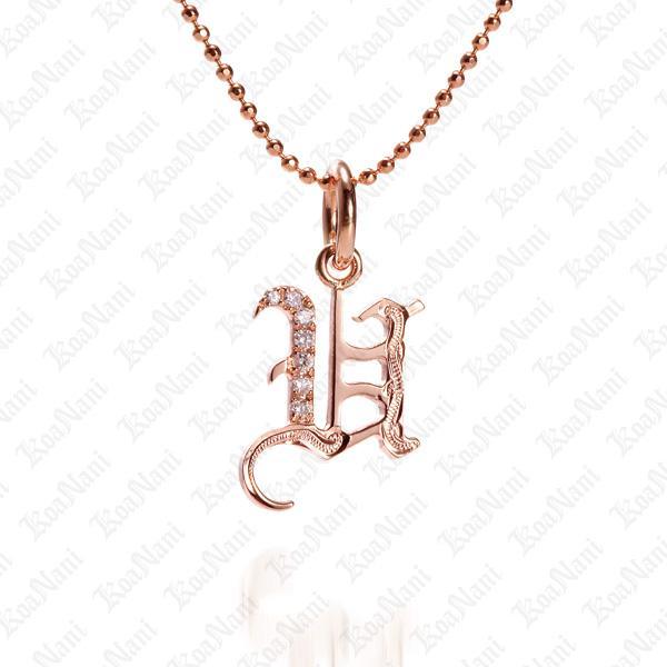 The picture shows a 14K rose gold Koa Nani U initial pendant.