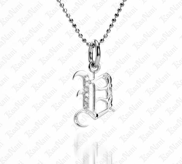 The picture shows a 14K white gold Koa Nani V initial pendant.