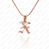 The picture shows a 14K rose gold Koa Nani X initial pendant.