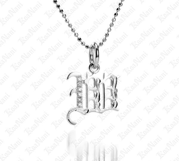 The picture shows a 14K white gold Koa Nani W initial pendant.