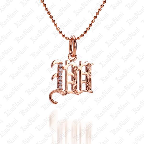 The picture shows a 14K rose gold Koa Nani W initial pendant.