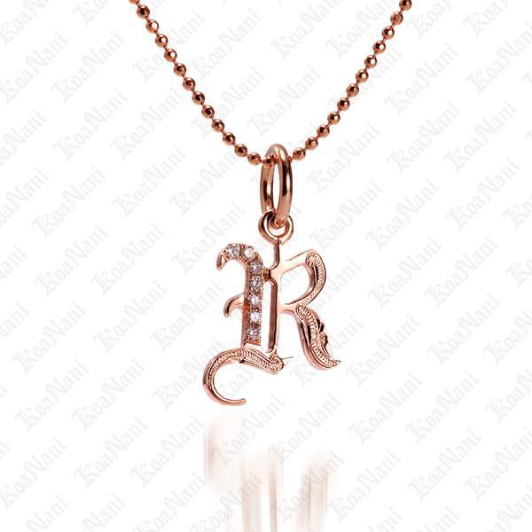 The picture shows a 14K rose gold Koa Nani R initial pendant.