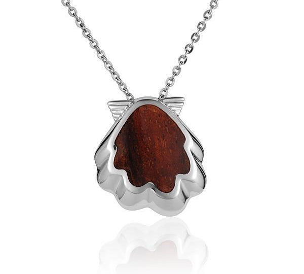 In this photo there is a sterling silver and koa wood oyster shell pendant.