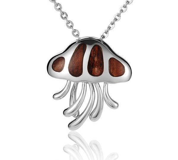 In this photo there is a sterling silver and koa wood jellyfish pendant.