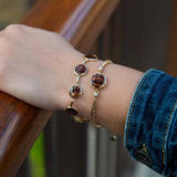 14K gold bracelet featuring a Koa wood centerpiece with two diamonds on the sides. 