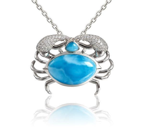 The picture shows a 925 sterling silver blue crab treasure pendant  with hand-selected larimar gemstones and topaz.