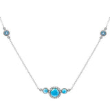 The picture shows a 14K white gold necklace with three larimar gemstones paired with diamonds and two aquamarine gemstones.