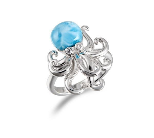 The picture shows a 925 sterling silver larimar octopus ring with topaz eyes.