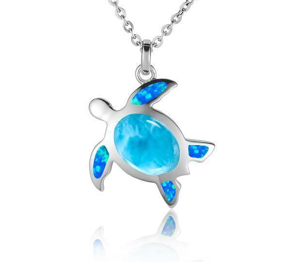 The picture shows a 925 sterling silver sea turtle pendant with one larimar gemstone and four opalite.