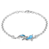 The picture shows a 925 sterling silver larimar two dolphin lovers bracelet with topaz.