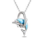 The picture shows a 925 sterling silver larimar dolphin through circle pendant with topaz.