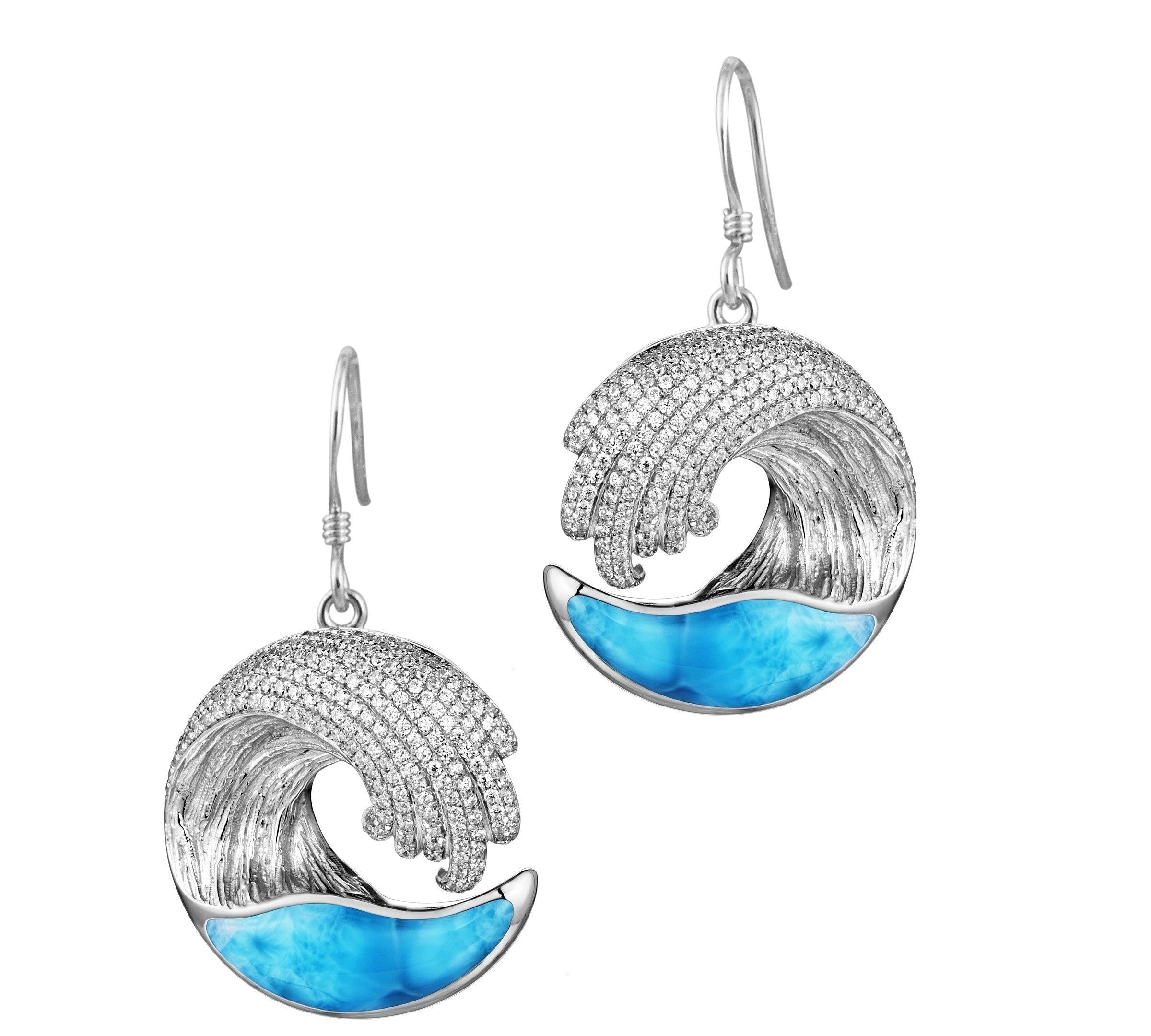 The picture shows a large pair of 925 sterling silver larimar ocean wave hook earrings with topaz.