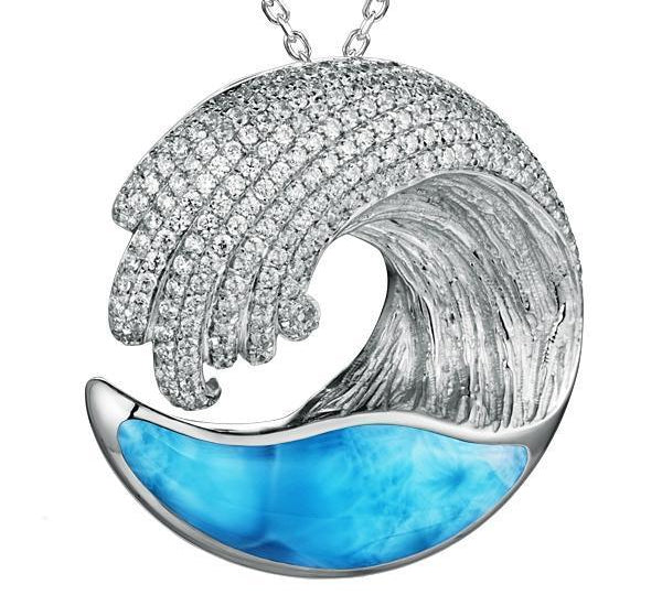 The picture shows a 925 sterling silver larimar ocean wave pendant with topaz.