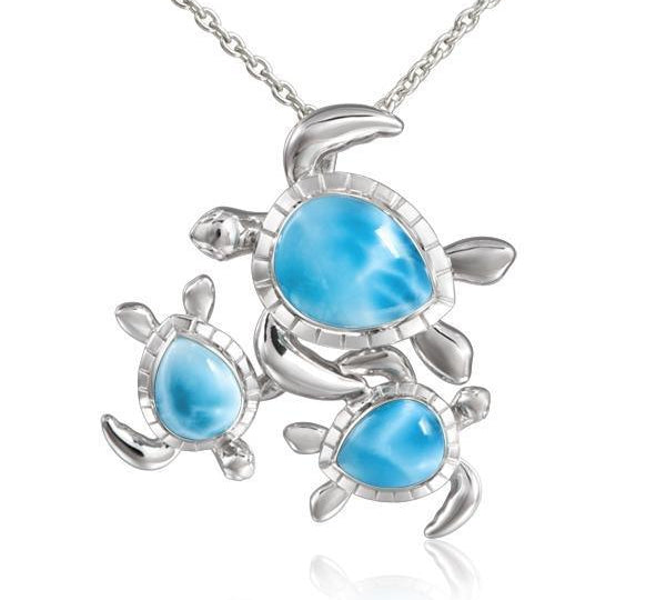 The picture shows a 925 sterling silver family of three sea turtles pendant with larimar.