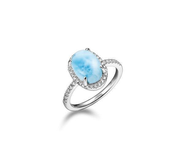 The picture shows a 925 sterling silver larimar oval ring lined with topaz.