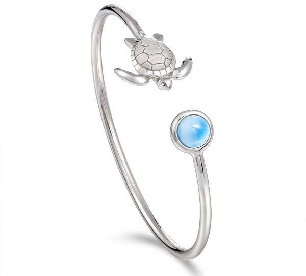 The picture shows a 925 sterling silver larimar sea turtle bangle.