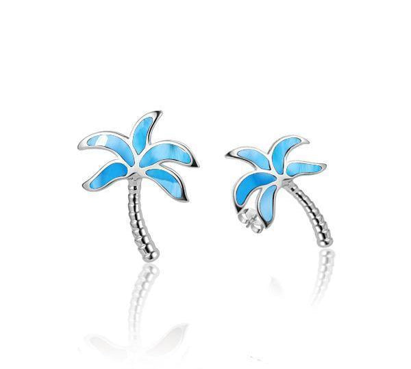 In this photo there is a pair of 925 sterling silver palm tree stud earrings with larimar gemstones.