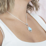 The picture shows a 925 sterling silver larimar reuleaux wave pendant.