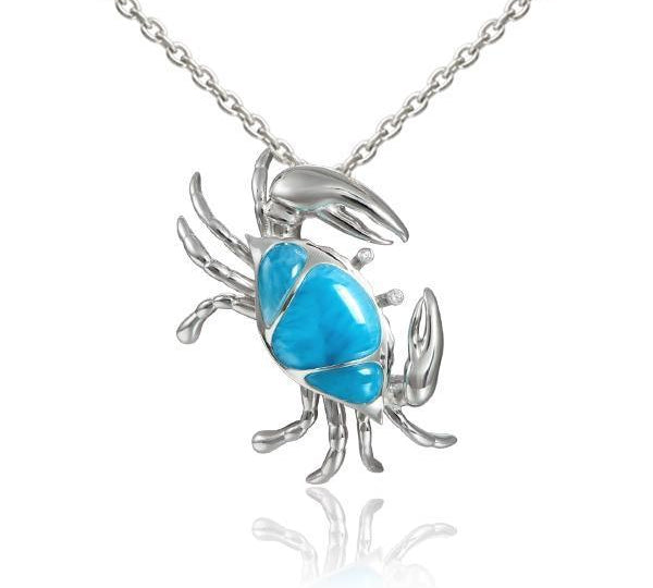 The picture shows a 925 sterling silver larimar sand dune blue crab pendant.