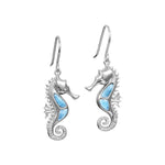 The picture shows a pair of 925 sterling silver larimar seahorse hook earrings with topaz.