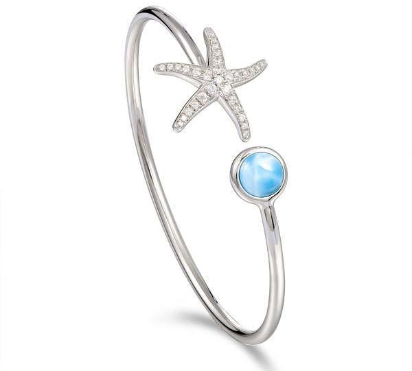 The picture shows a 925 sterling silver larimar starfish and circle bangle with topaz.