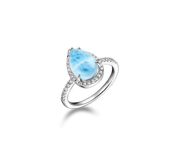 The picture shows a 925 sterling silver larimar teardrop ring with a topaz band.