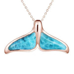 The picture shows a 14K rose gold larimar whale tail pendant.