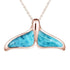 The picture shows a 14K rose gold larimar whale tail pendant.