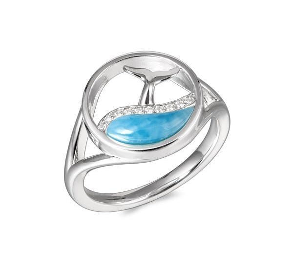 The picture shows a 925 sterling silver larimar whale tail in a wave ring with topaz.