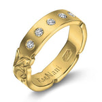 The picture shows a 14K yellow gold 4mm ring with hand engravings and diamonds.
