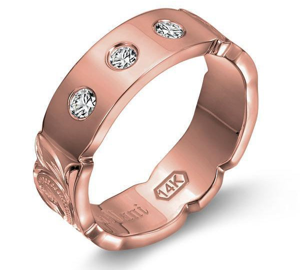 The picture shows a 14K rose gold 6mm ring with hand engravings and diamonds.