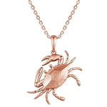 The picture shows a 14K rose gold blue crab pendant.