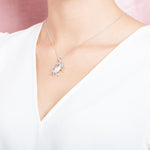 The picture shows a model wearing a 925 sterling silver crab pendant.