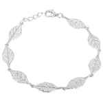 In this photo there is a white gold plated maile leaf bracelet with cubic zirconia.