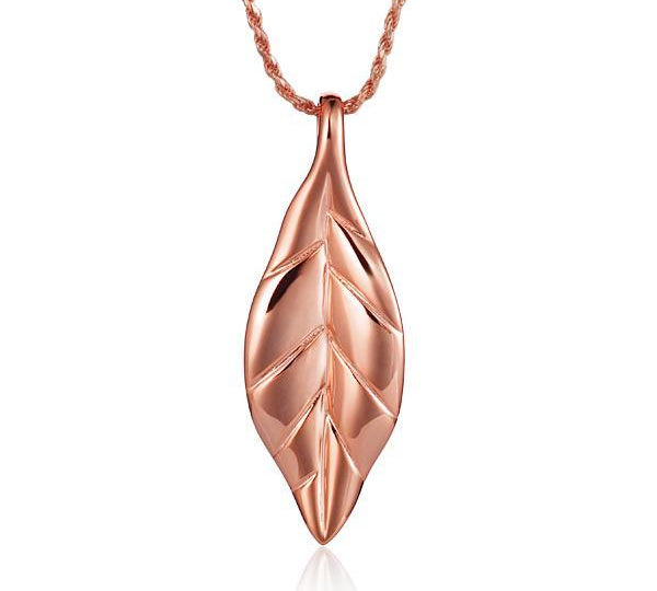 In this photo there is a rose gold maile leaf pendant.