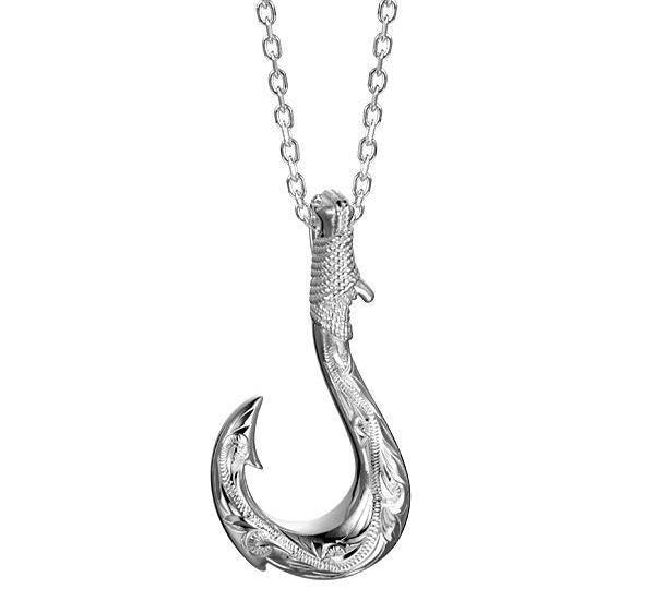 In this photo there is a sterling silver fish hook pendant with hand-engravings.