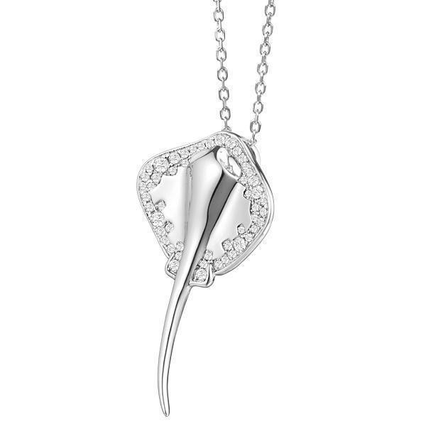 The picture shows a white gold manta ray pendant with topaz.