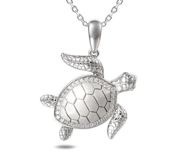 The picture shows a 925 sterling silver sea turtle pendant with topaz.