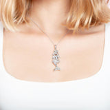 The picture shows a model wearing a 925 sterling silver mermaid pendant.