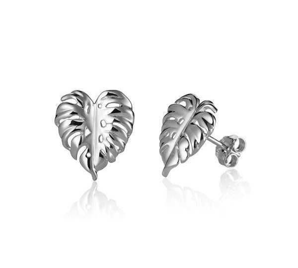 In this photo there is a pair of 14k white gold monstera stud earrings.