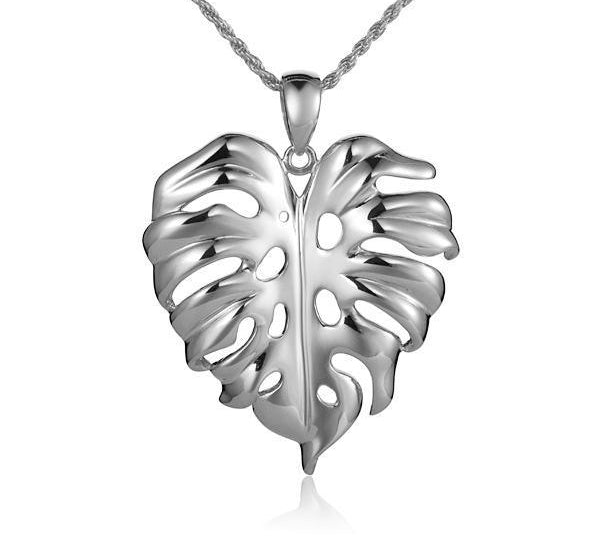 In this photo there is a white gold monstera pendant.