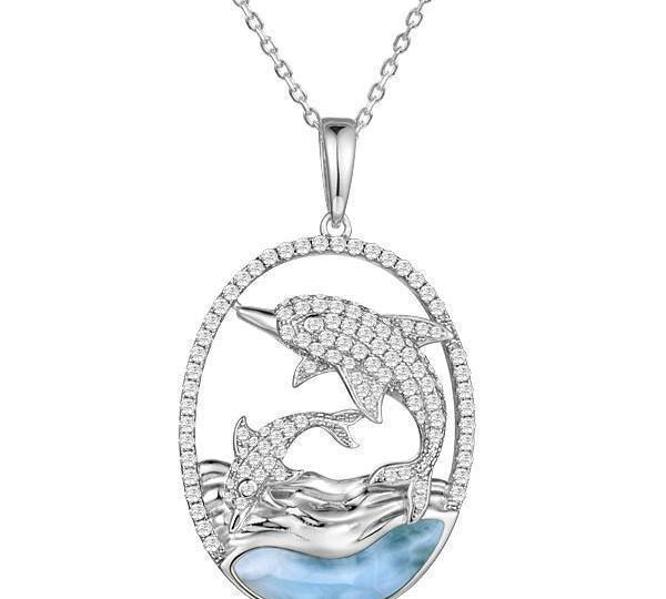 The picture shows a 925 sterling silver two swimming dolphins pendant with a larimar gemstone and cubic zirconia.
